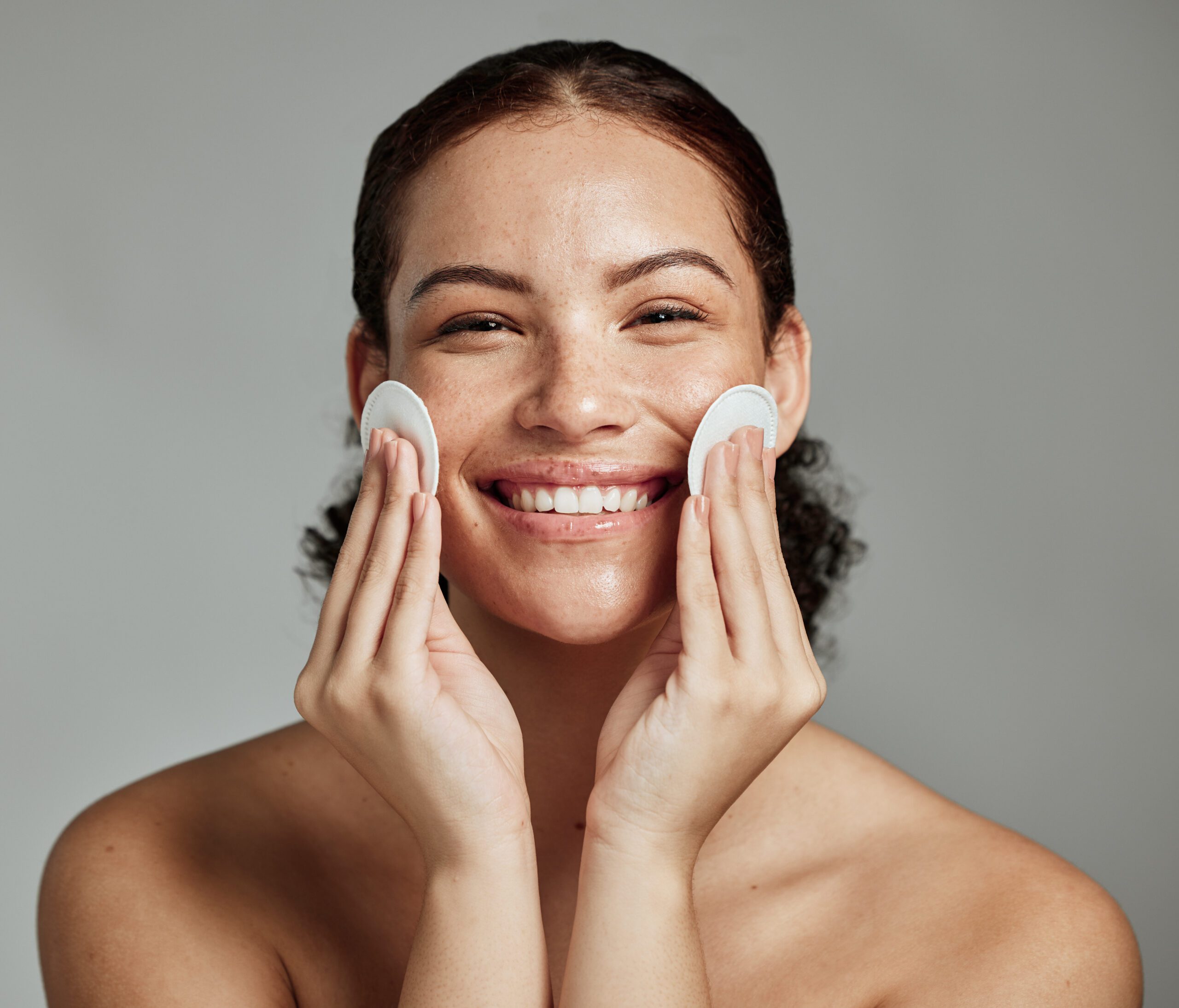 Skincare, beauty and portrait of a woman with cotton for face acne, cosmetic cleaning and dermatology