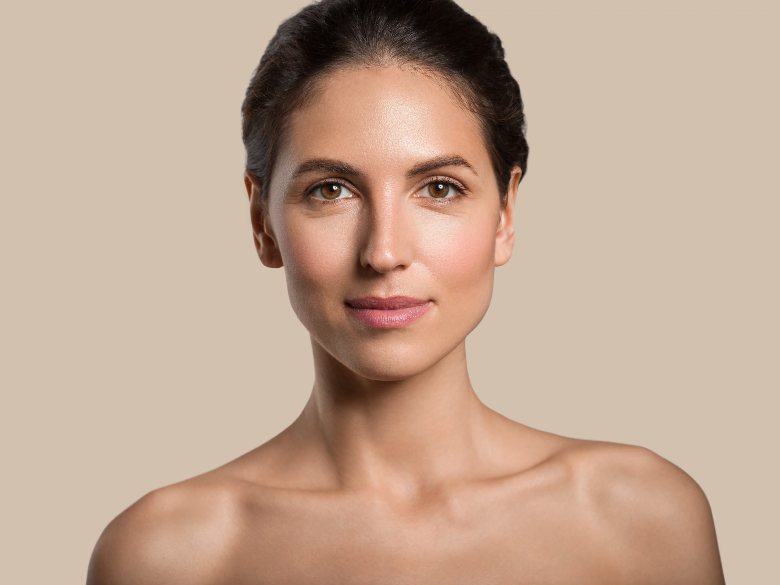 Beautiful woman healthy skin beauty face cosmetic concept color background Brown.